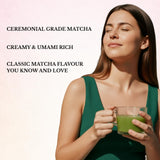 Woman holding a glass of matcha green tea with promotional text about ceremonial grade matcha.