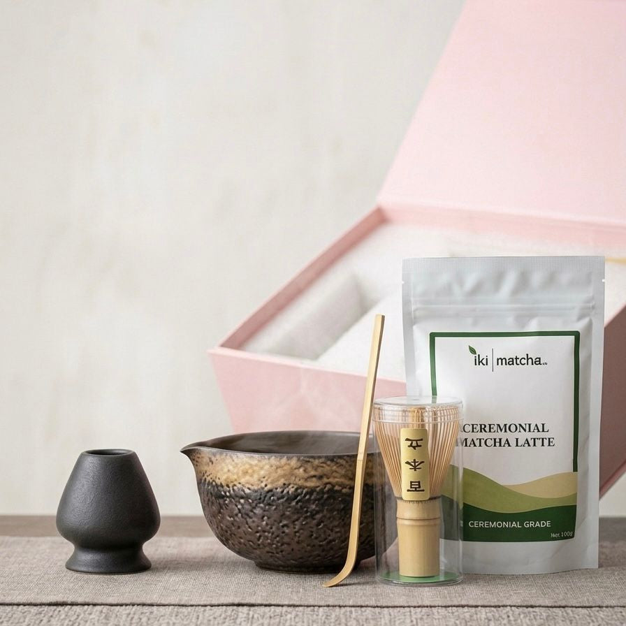 Iki Matcha ceremonial matcha latte packaging with traditional Japanese tea-making tools on a wooden surface.